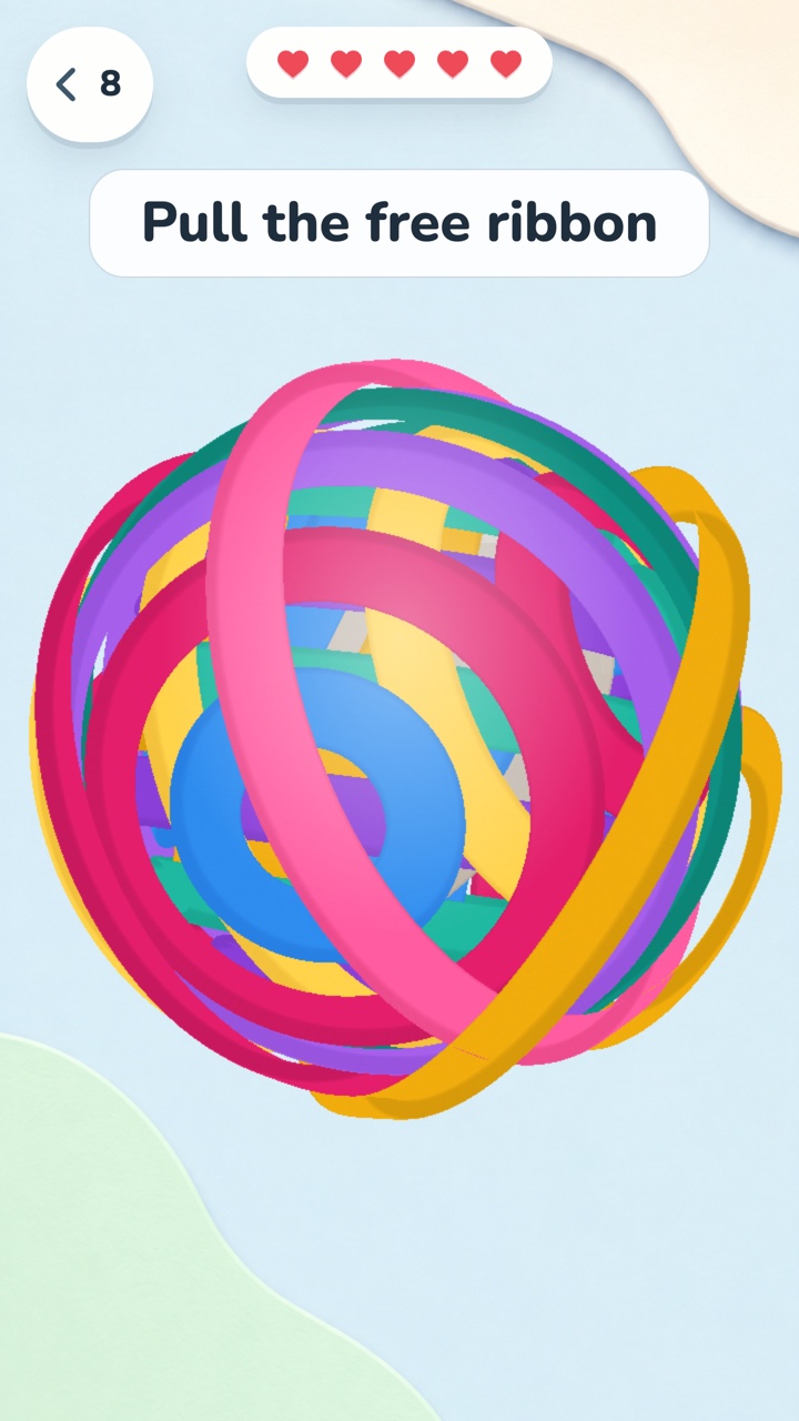 Tangle Pull gameplay: colorful paper ribbons around a ball, captioned Pull the free ribbon